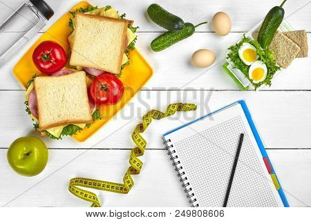 Top View Planning Notebook With Copy Space And Healthy Breakfast. Sandwich With Ham And Cheese, Eggs