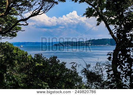 The Park And Lighthouse Of Kannonzaki As Seen Through The Trees Of Sarushima, A Small Natural Island