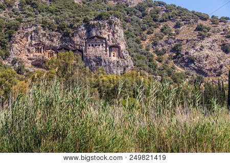 Lycian Tombs In The Mountains On The Dalyan River, Turkey. Dalyan Canal View. Dalyan Is Populer Tour
