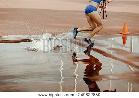 Steeplechase Female Athlete Runner Overcame Water Jump