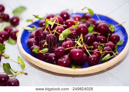 Fresh Cherries In Bowl On Table