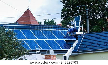 Miercurea Ciuc, Romania- July 17 2018: Workers Mounting Solar Panels On Residentual House.