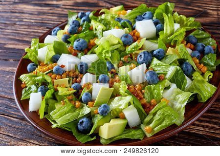 Mexican Salad With Blueberries, Romaine Lettuce Leaves, Jicama, Roasted Corn Kernels And Avocado On 
