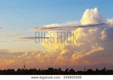 Heapy Clouds With Warm Sunset's Ray.