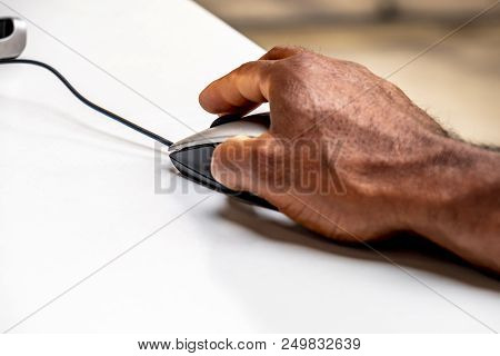African Man Using Mouse To Control The Computer.