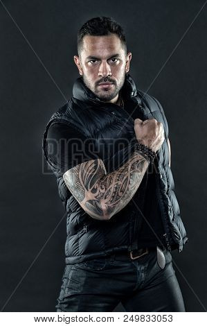 Tattooed Man In Trendy Clothes. Man With Tattoo On Strong Arm Skin. Fashion Macho With Confidence An