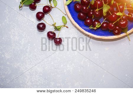 Beautiful Texture, Background With Ripe Cherries In A Plate, Top View