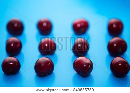 Isolated Cherry. Collection Of Cherries Isolated On Blue Background