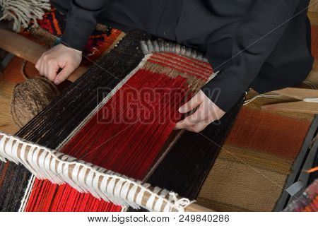 An Arab Woman Makes A Traditional Sadu Weaving. Hands Of A Weaver Close-up, Focus On Hands. Qatar
