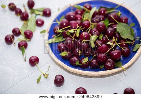 Healthy Cherry Fruits In Blue Bowl. Fresh Berries