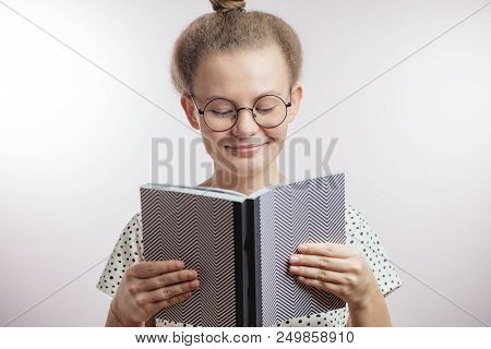 Smiling Woman Reading A Novel. Bookworm. Bookish. Free Time. Hobbyeducation Concept