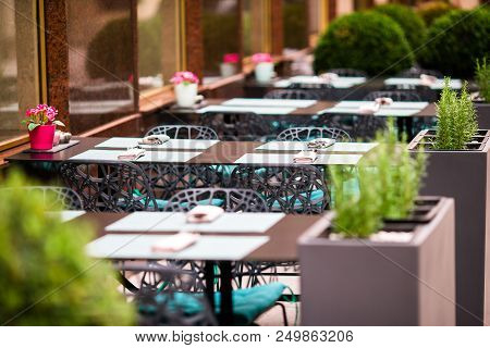 Summer Empty Open Air Restaraunt In Italian City In Vienna. Closeup Wineglasses On The Table