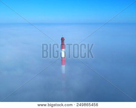 Brick Chimney Floating Above The Clouds, Aerial View.