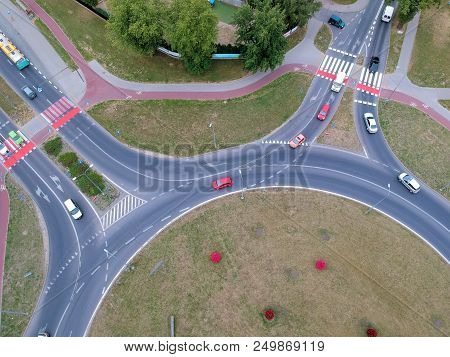 Roundabout Intersection In Two Directions With Island, Aerial View.