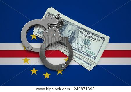 Cabo Verde Flag  With Handcuffs And A Bundle Of Dollars. Currency Corruption In The Country. Financi