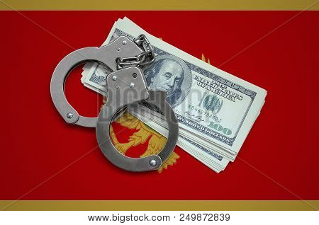 Montenegro Flag  With Handcuffs And A Bundle Of Dollars. Currency Corruption In The Country. Financi
