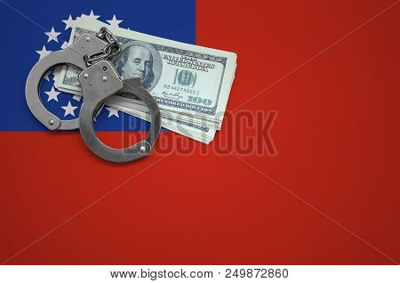 Myanmar Flag  With Handcuffs And A Bundle Of Dollars. The Concept Of Breaking The Law And Thieves Cr
