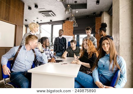 Multi-ethnic Meeting Of Experts Of Advertisments. Novice Lawyers Are Sharing Of Experience Indoors