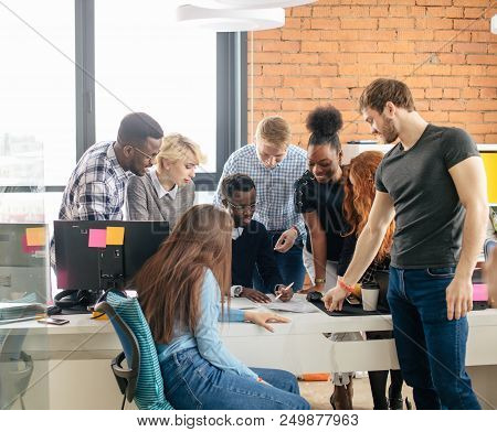 Multiracial Contemporary Business People In Working Process In Modern Studio