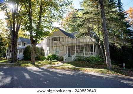 Bay View, Michigan / United States - October 17, 2017: A Beige Two Story Victorian Cottage, With A B