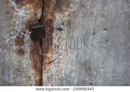 Photo Of Rust Locked Metal Doors And Keylock