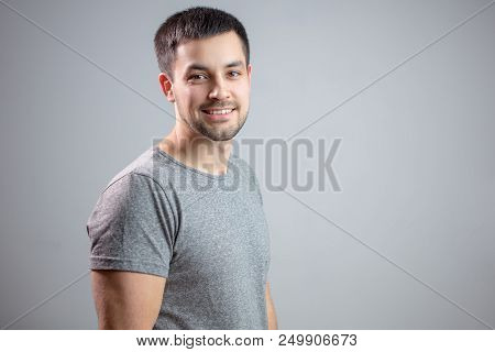 Close Up Side View Photo Of Pleasant Bearded Student. Copy Space. Strret Man With Positive Look. Uns