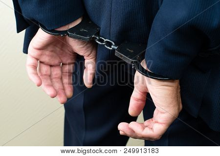Arrested Businessman In Handcuffs. Businessman Bribetaker Or Briber. Concept Of Fraud, Detention, Cr