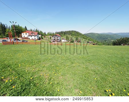 House At Marvelous Landscapes Of Grassy Terrain And Forest At Beskid Mountains Range In European Sal