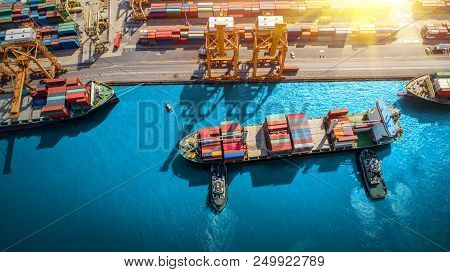 Logistics And Transportation Of Container Cargo Ship And Cargo Plane With Working Crane Bridge In Sh