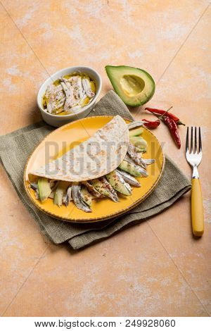 piadina with avocados marinated anchovies and hot chili pepper