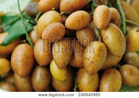 Wampee Fruit Sell In The Tropical Fruits Market