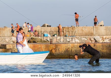 Bolata Beach, Bulgaria - Aug 3, 2014: Wedding And Lifestyle  Photographer Shoots A Couple Of Affecti