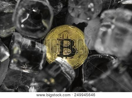 Gold Bitcoin On Ice Background. The Concept Of The Exchange In Winter. Freeze. Blockchain Mining. Di