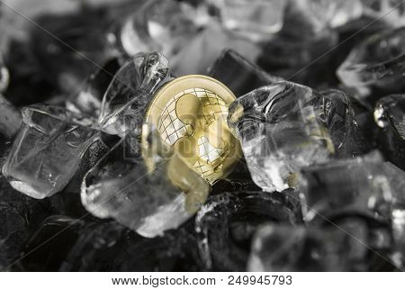Gold Ripple Coin On Ice Background. The Concept Of The Exchange In Winter. Freeze. Blockchain Mining