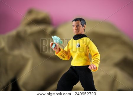JUN 23 2018: Recreation of a scene from Star Trek The Original Series where Captain Kirk draws his phaser after beaming down to the mysterious planet - Mego vintage style action figures