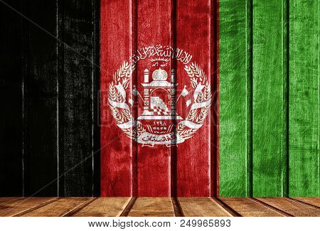 Wooden Background With A Flag Of Afghanistan. There Is A Place For Your Text In The Photo.