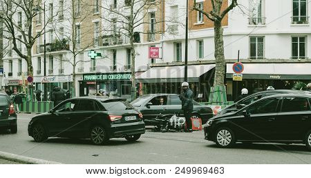 Paris, France - Jan 30, 2018: Man Near Accidented Scooter Paris Street Moped Transporting Medical Tr