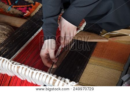 An Arab Woman Makes A Traditional Sadu Weaving. Hands Of A Weaver Close-up, Focus On Hands. Qatar
