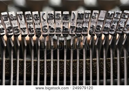 Macro Photo Of Typebars Of A Retro Typewriter In The Studio. Horizontal.