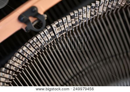 Nice Macro Photo Of Typebars Of A Retro Typewriter In The Studio. Horizontal.