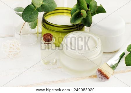 Making Herbal Beauty Care Remedy Of Oil, Green Holistic Plants, Fresh Cream, Sea Salt. Jars And Bott