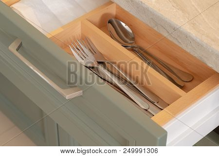 Shelf With Cutlery In The Kitchen With A New Design