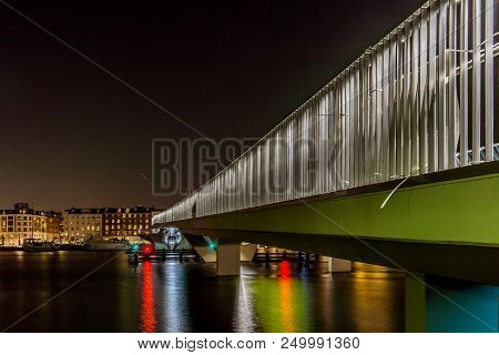 Copenhagen Waterfront Bike Lane At Night, Inner Harbor Bridge With Reflections In The Water, Copenha