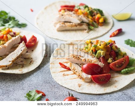 Tortillas With Grilled Chicken Fillet, Salsa Mango Sauce And Tomatoes