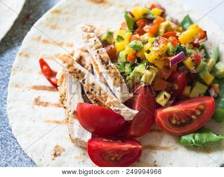 Tortillas With Grilled Chicken Fillet, Salsa Mango Sauce And Tomatoes