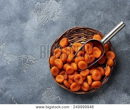 Dried Apricots On Gray Background. Witn Copy Space. Top View.