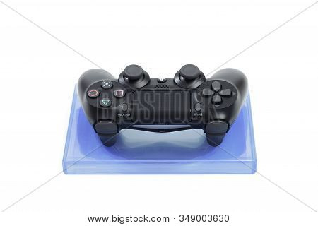 Russia, Oktober 24 2019:  Sony Play Station 4 Pro Gaming Console On The Table With  Joystick And Som