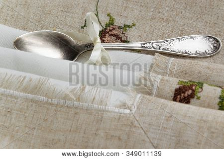 Vintage Russian Silverspoon With Silk Ribbon On Linen Napkin. Old Fashion Heroloom Silverware