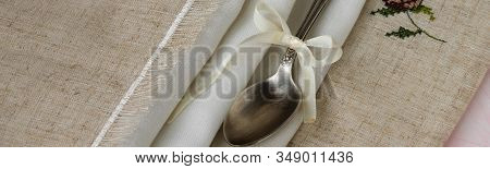Vintage Russian Silverspoon With Silk Ribbon On Linen Napkin. Old Fashion Heroloom Silverware