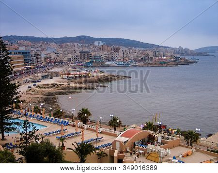 Bugibba, Malta - June 13, 2005: Aerial View Of Maltese Town Seafront And Its Bay Area In Bugibba, Ma